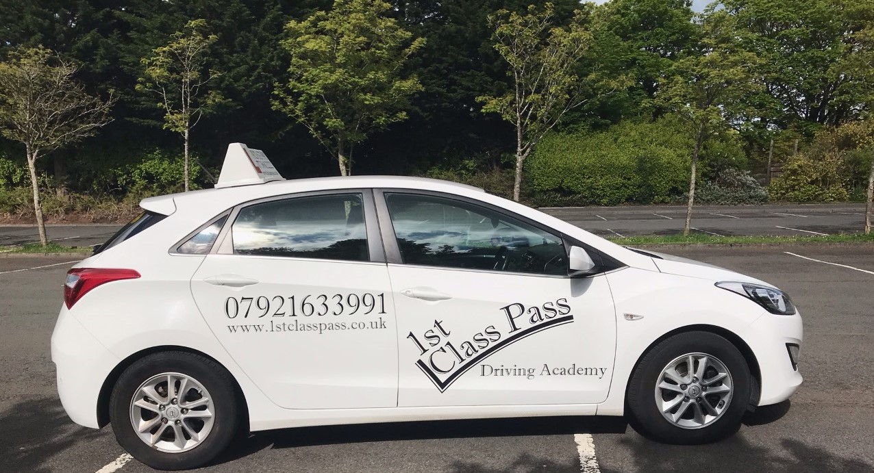 side view of 1st Class Pass driving instructor car